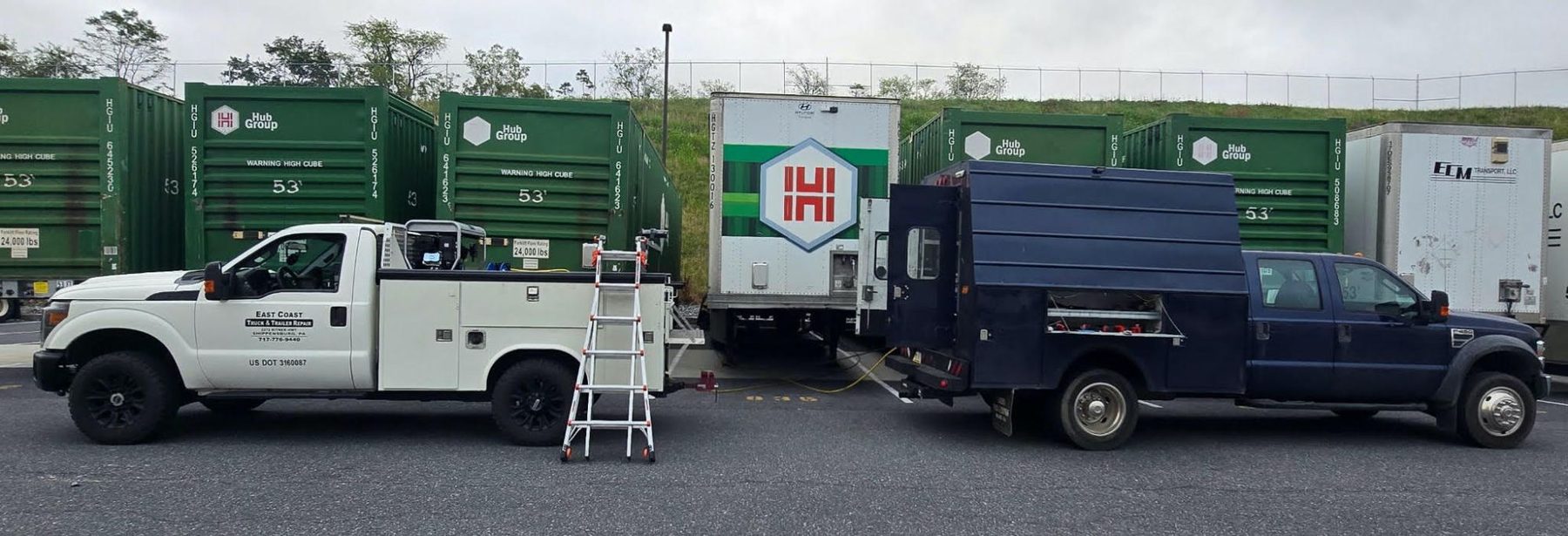 East Coast Truck & Trailer Repair mobile service trucks working on a box truck at a customer&rsquo;s yard